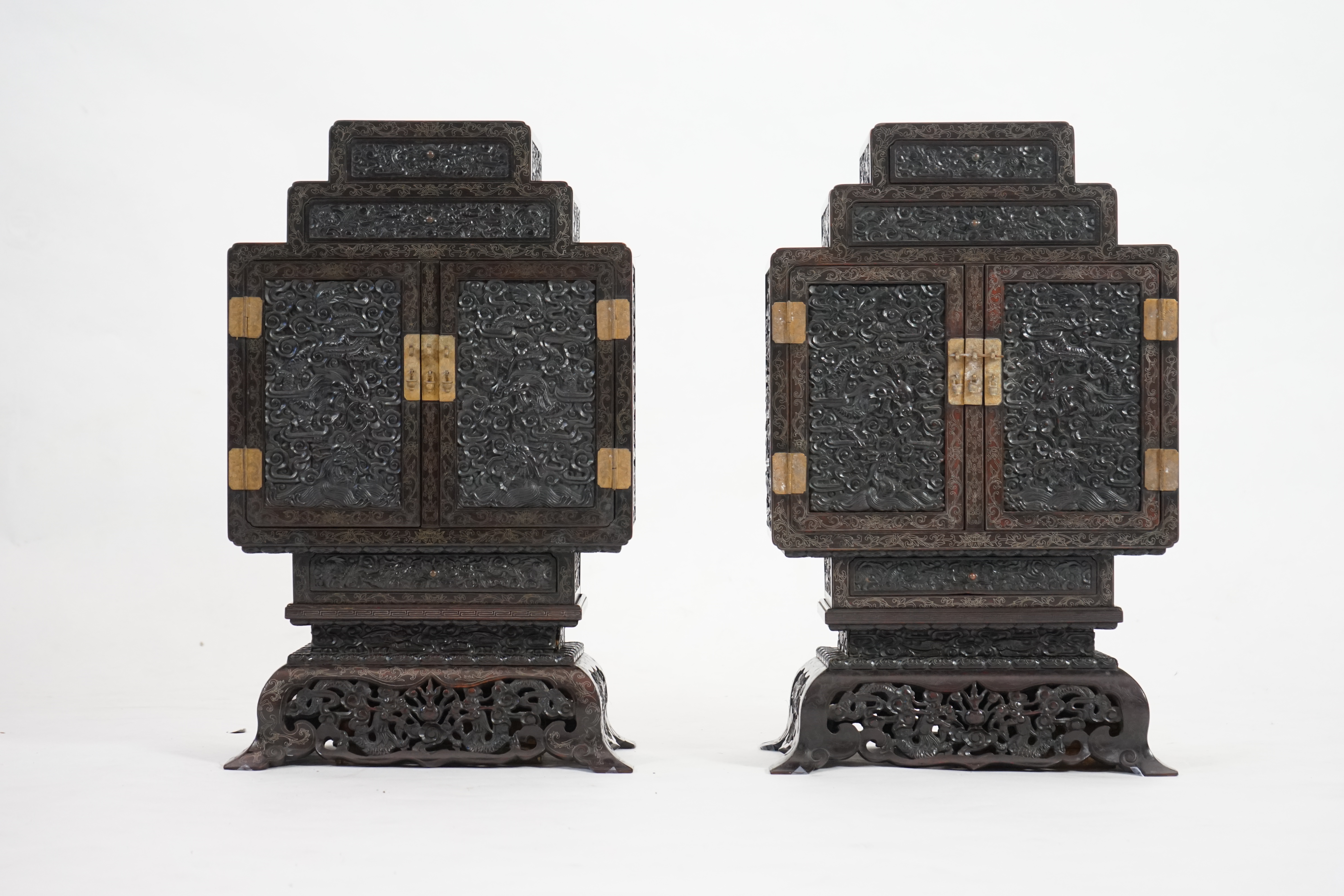 An important pair of Chinese carved zitan and silver wire inlaid ‘cloud and dragon’ curio cabinets and stands, duobaoge, probably Imperial, late Qing dynasty